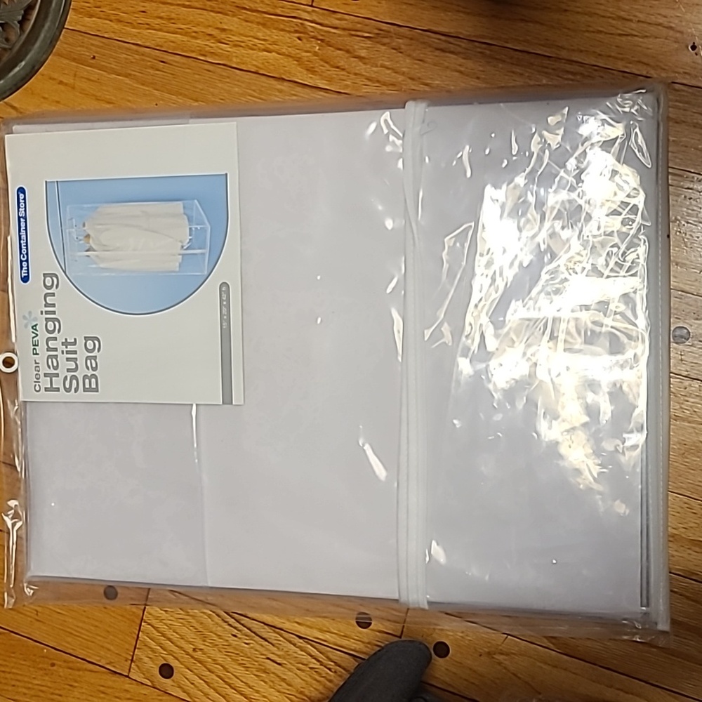 The container store clear Peva free hangibg bag suit.  Clear